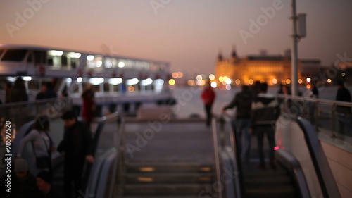 Out of focus background and unrecognizable people walking around pier Kadikoy,Istanbul  photo