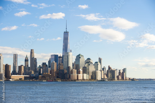 Blue sky view of the Downtown Manhattan skyline from across the Hudson River in New Jersey