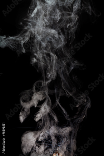Abstract Smoke from rebuildable drip atomizer (RDA) on a black color background © Jenov Jenovallen