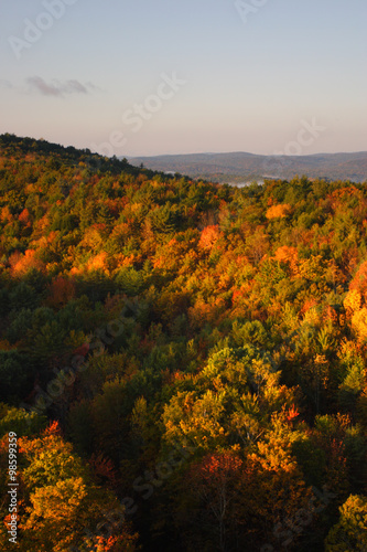 An aerial view of a hot air balloon floating over the Vermont country side ..