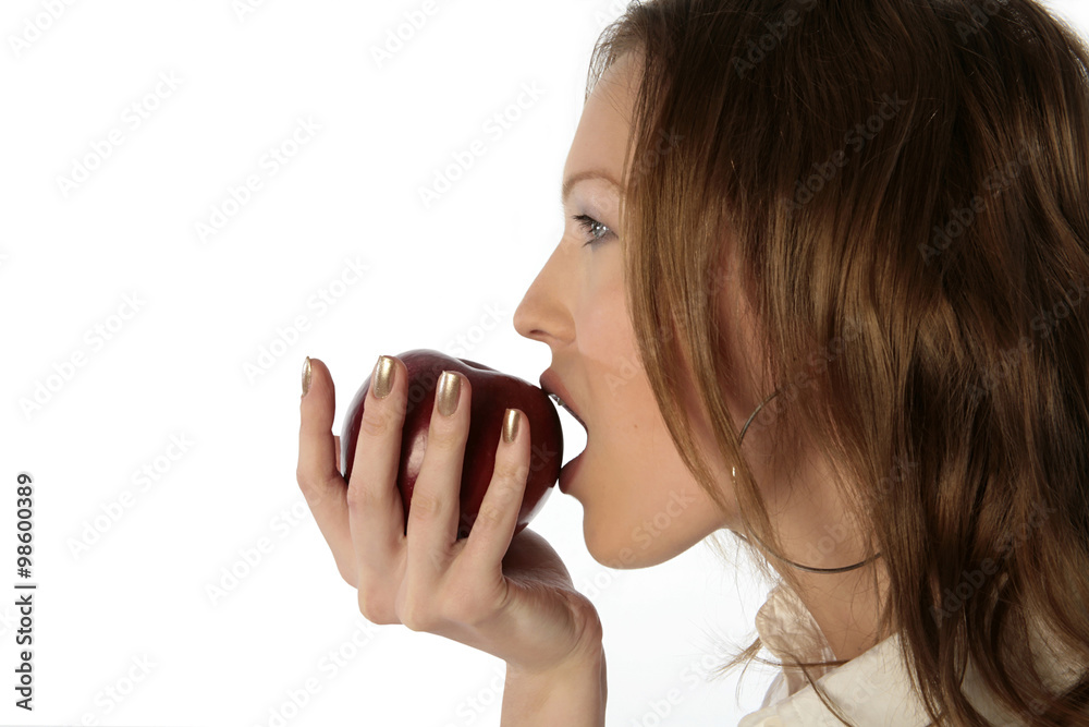 girl bites an apple isolated on white background girl bites an apple isolated on white background