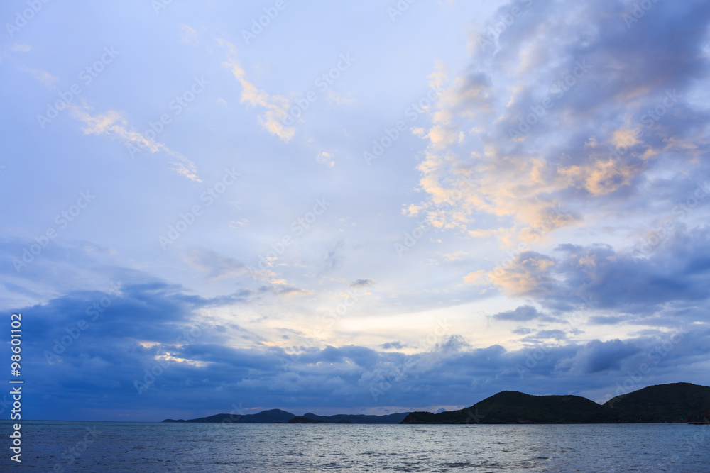 Sunset over the Sea with clouds in the blue sky Sunset over the Sea with clouds in the blue sky
