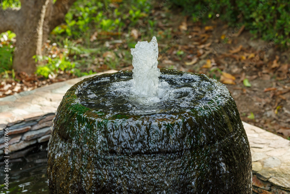 close up jar fountain in the garden