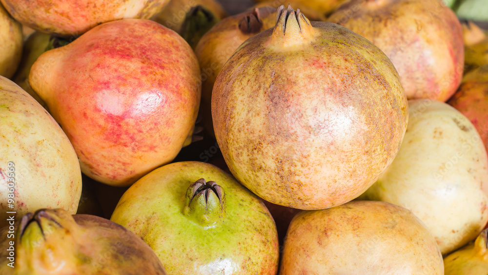 pomegranate ripe unattractive on basket in maket pomegranate ripe unattractive on basket in maket