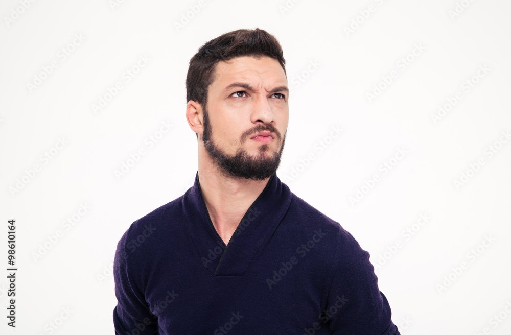 Dissatisfied frowning handsome young man with beard in sweetshirt Dissatisfied frowning handsome young man with beard in sweetshirt