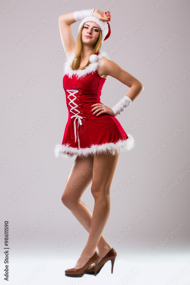 Beautiful happy woman in Santa Claus clothes Beautiful happy woman in Santa Claus clothes