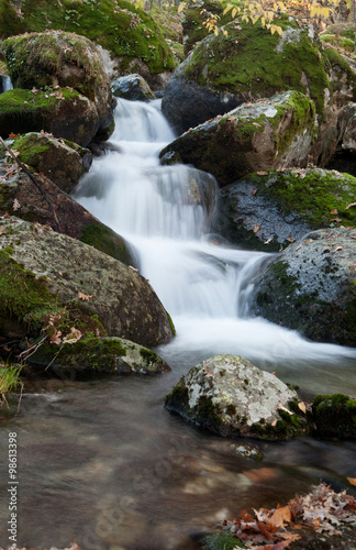 Fototapeta Naklejka Na Ścianę i Meble -  Beautiful waterfall and big rocks