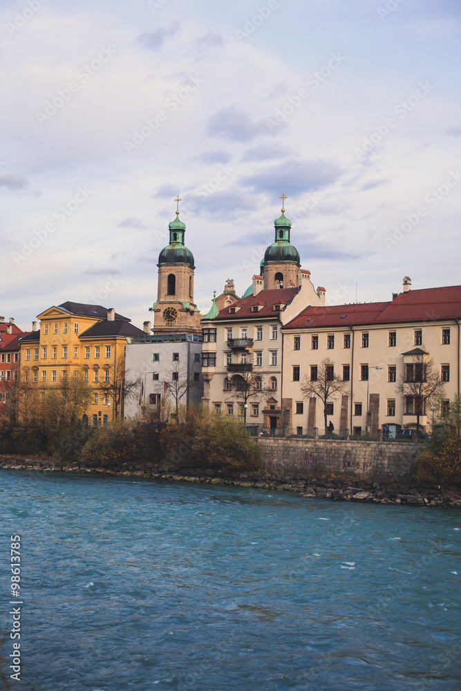 Beautiful super wide-angle aerial view of Innsbruck, Austria with skyline, Alps mountains and scenery beyond the city, and Inn river 