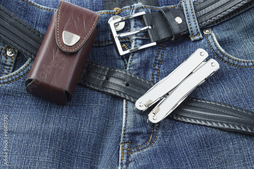 Blue jeans with stainless multitool knife