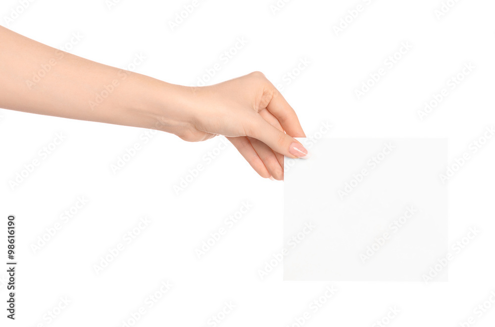Branding and advertising theme: beautiful female hand holding a blank white paper card isolated on white background Branding and advertising theme: beautiful female hand holding a blank white paper card isolated on white background
