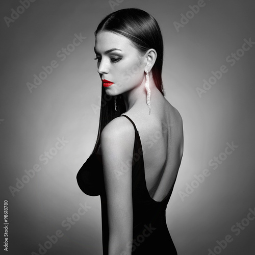 Monochrome fashion photo of beautiful young woman wearing jewelry