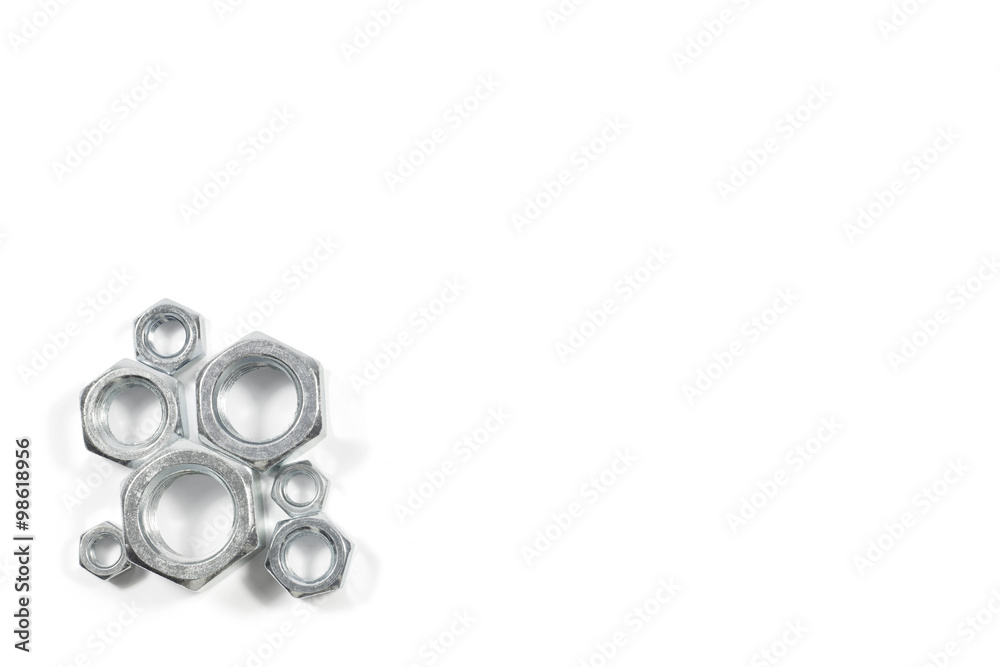Heap Of Metal Nuts Of Various Sizes Isolated On White Background Heap Of Metal Nuts Of Various Sizes Isolated On White Background