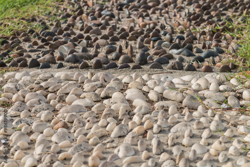 Mini stone dark and white half and half bury on the sand for dec Mini stone dark and white half and half bury on the sand for dec