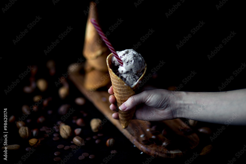 Cold Homemade Eggnog Cone Ice Cream with Chocolate. Dark photo, Selective focus