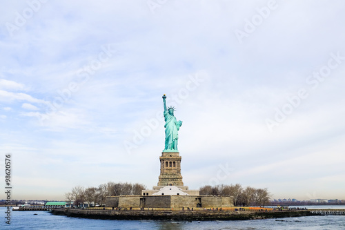An image of the famous Statue of Liberty island as seen from the Liberty Cruise. © ichywong