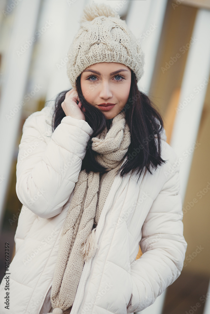 Portrait of a beautiful brunette outdoors in late autumn