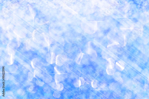 Solf blue lights festive blurry and star on white bokeh abstract
