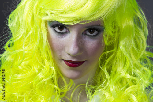 teenager with fluorescent yellow wig