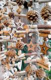 Winter background with cones and wooden stars.