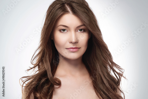 Attractive woman with long brown hair.