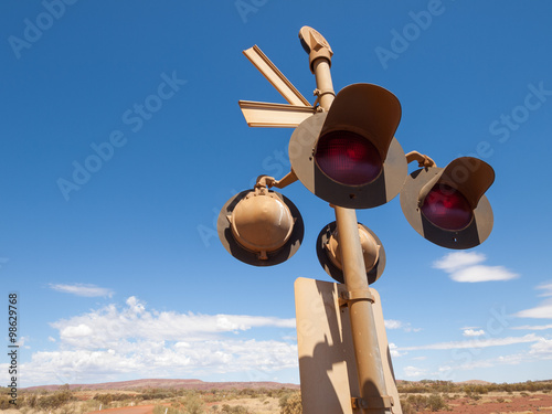 Australia, Northern territory, 05/21/2014, Outback railroad crossing signal lights photo