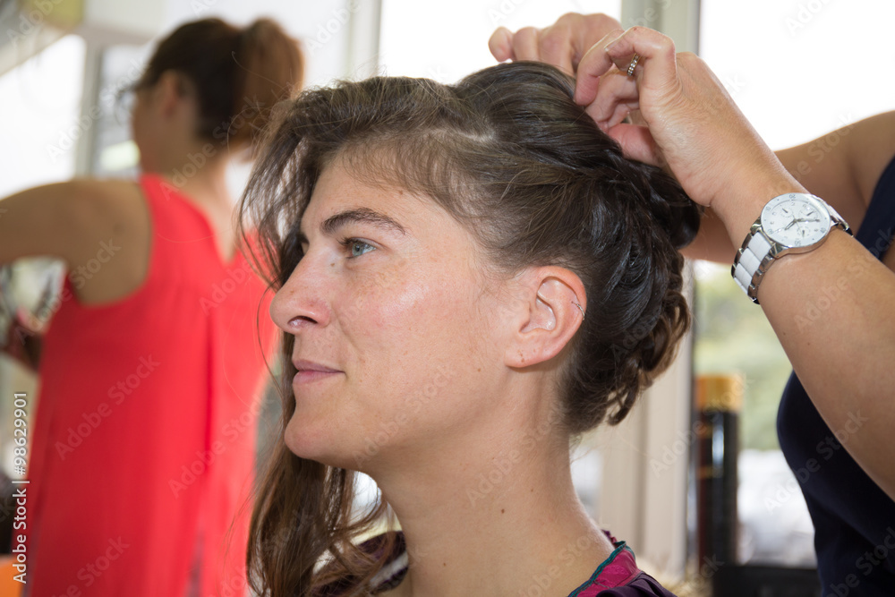 A bride at hairdressing salon before wedding A bride at hairdressing salon before wedding