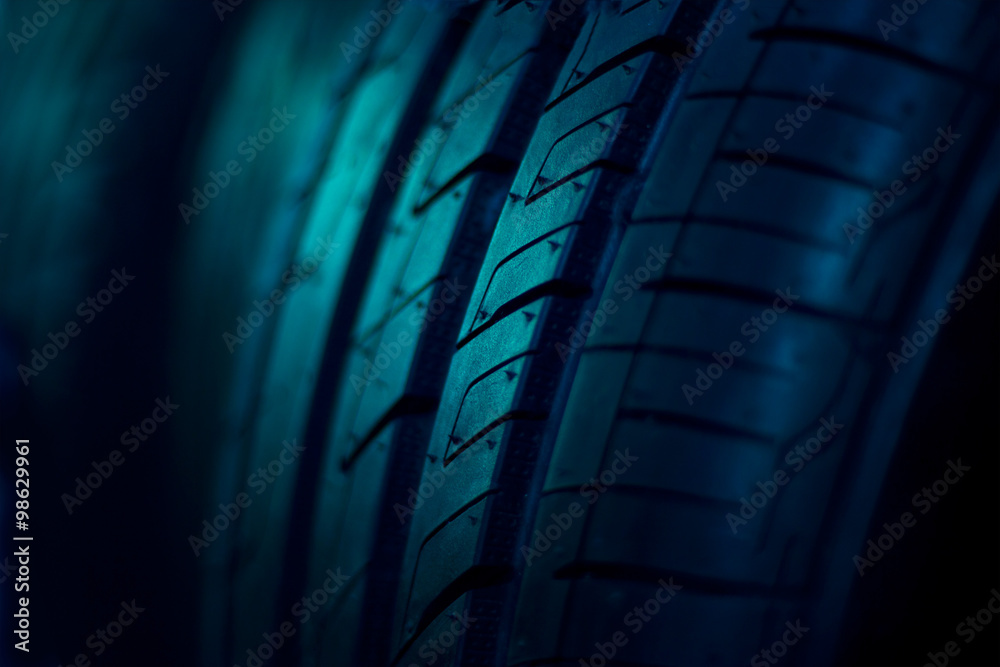 Fototapeta premium close up car tyres on dark background