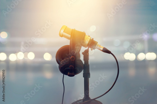 Close up microphone and headphone for announcer in boxing stadium photo