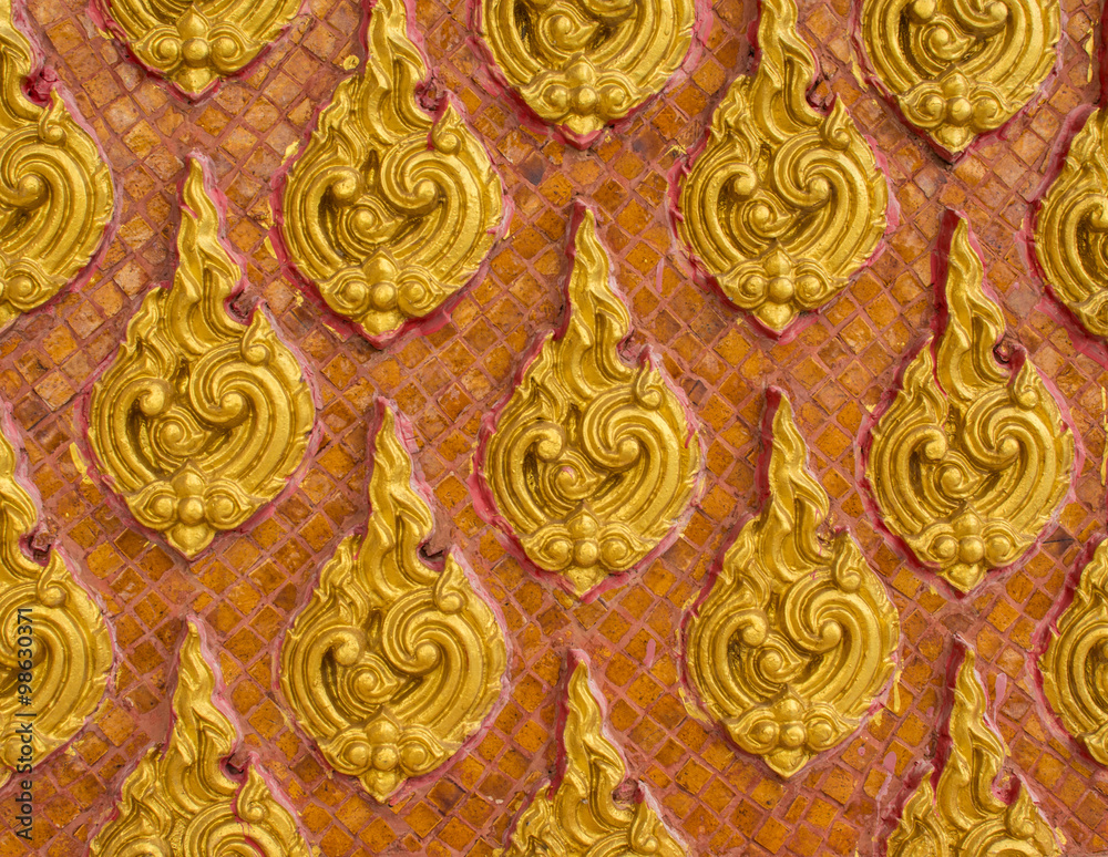 golden thai style stucco on wall in temple golden thai style stucco on wall in temple