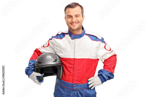 Canvas Print Young car racer holding a gray helmet