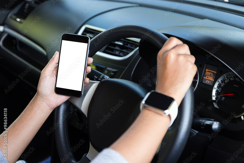 hand holding phone white screen and driving car