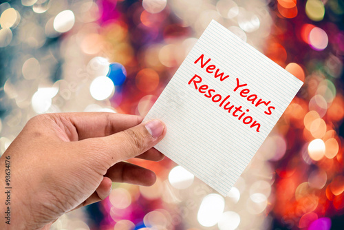 New Year's  Resolution handwriting on a sticky note