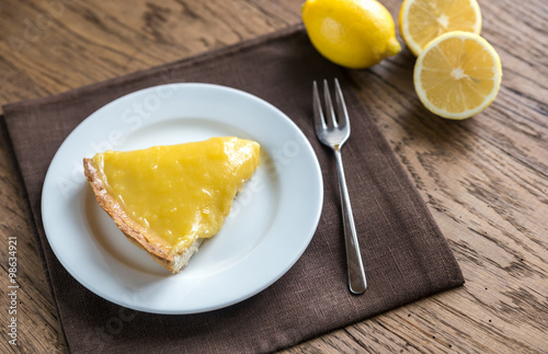 Slice of lemon tart on the plate