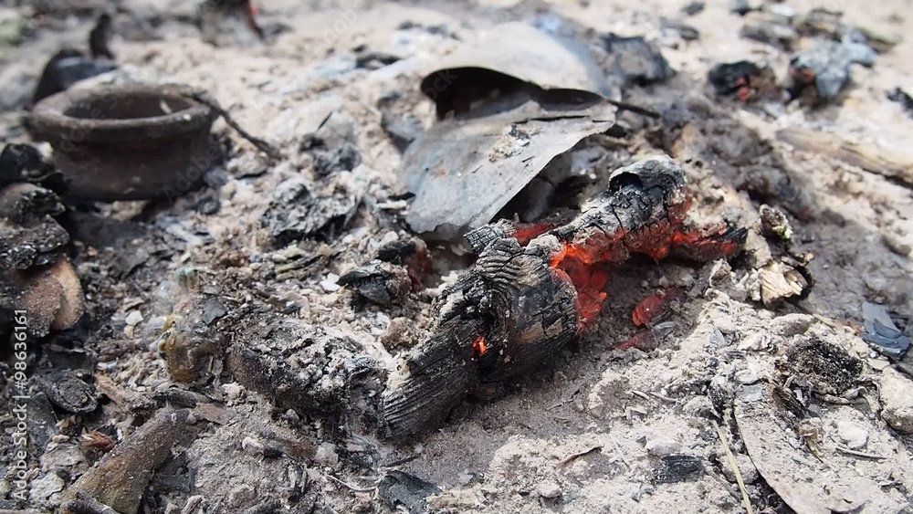 incandescent coal on remains of bonfire blown by the wind incandescent coal on remains of bonfire blown by the wind