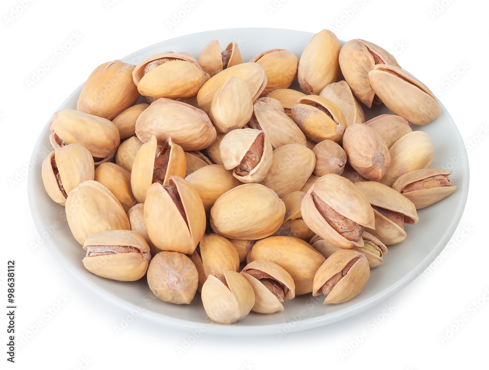 pistachios on white plate isolate
