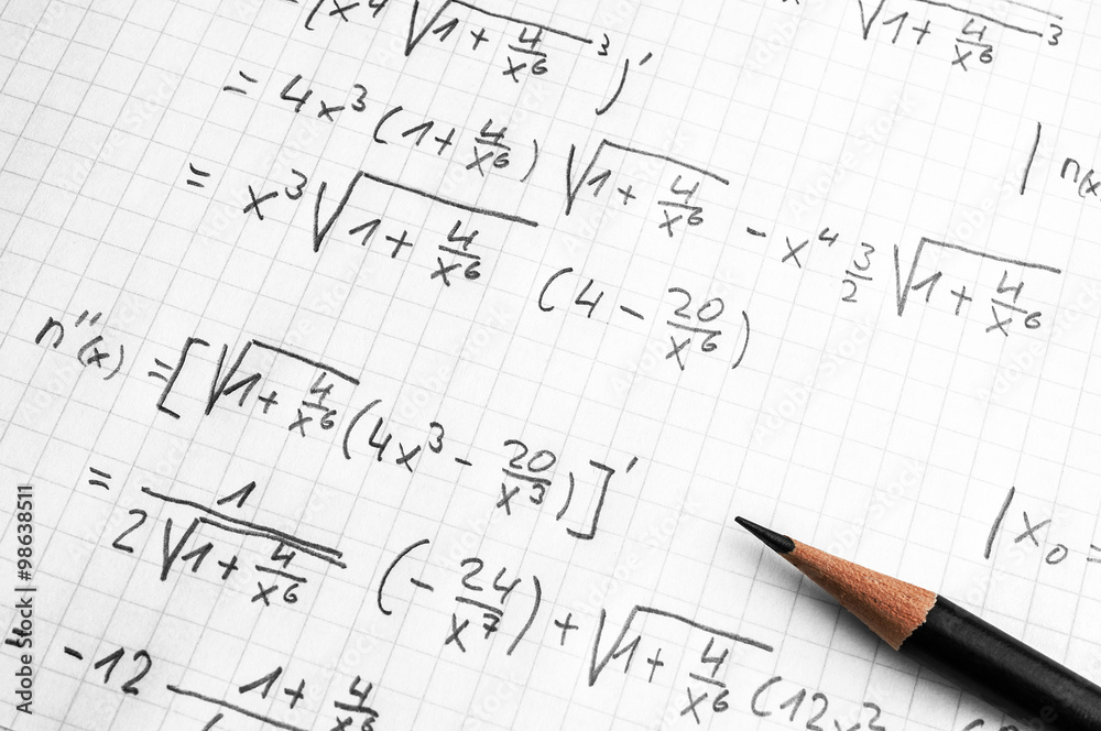 Maths concept - handheld calculator and pencil over a sheet of paper with maths-formulas Maths concept - handheld calculator and pencil over a sheet of paper with maths-formulas