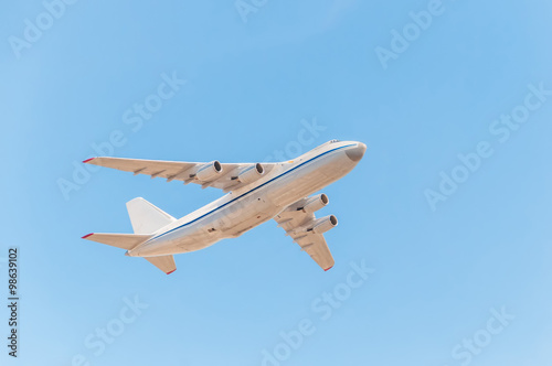 Fototapeta Naklejka Na Ścianę i Meble -  An-124-100 Ruslan (Condor) the world largest cargo strategic airlift jet airplane flies against blue sky background.
