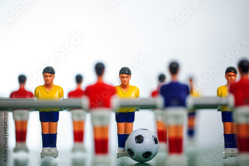 Table football game with yellow and red players