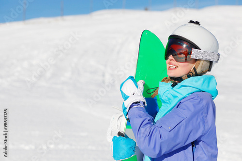 portrait of a snowboarder on the top of Dolomiti Alps photo