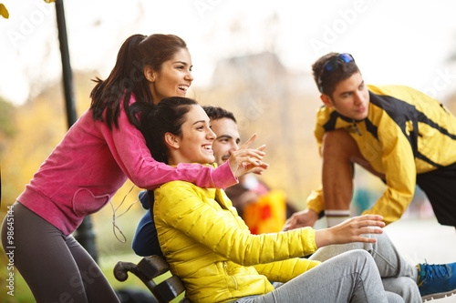 Young runners sitting on bench and relaxing after jogging. © BalanceFormCreative