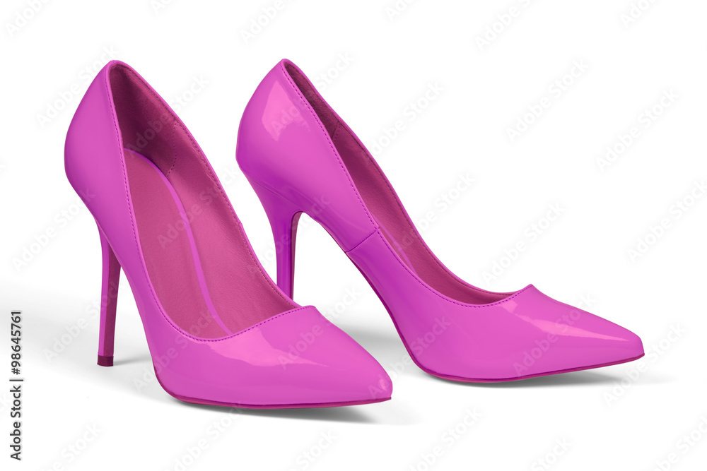 A pair of pink women's heel shoes isolated over white with clipping path. A pair of pink women's heel shoes isolated over white with clipping path.
