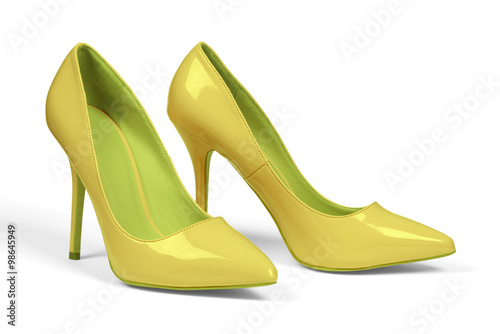 A pair of yellow women's heel shoes isolated over white with clipping path.