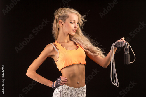 Cute woman with skipping rope. photo