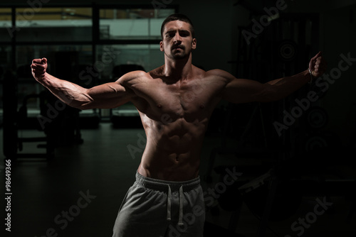 Bodybuilder Posing In The Gym