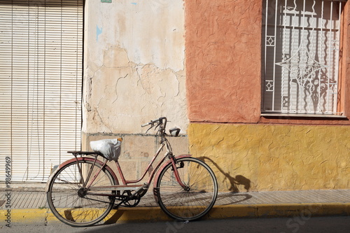 Antique Bicycle parked on the street of a village
