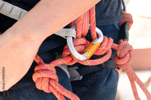 Climbing,Male hands tying a knot for rock climbing.