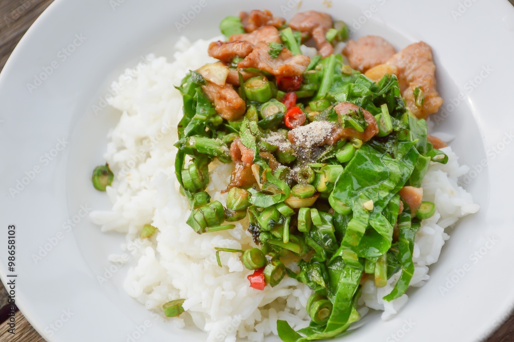 pork and vegetable fried on hot rice - Thailand healthy food