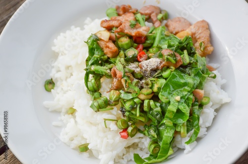 pork and vegetable fried on hot rice - Thailand healthy food