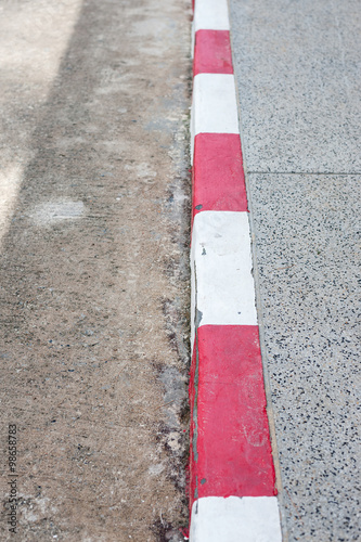 driveway, sidewalk and curb red-white © seksanpk