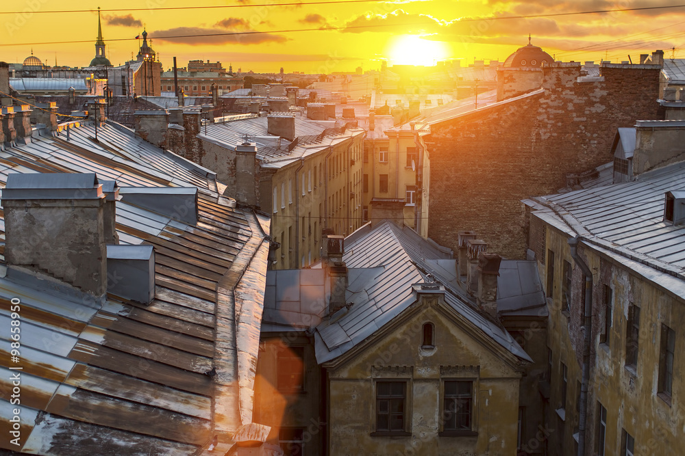 Amazing sunset on the roofs of the old district of St. Petersburg.